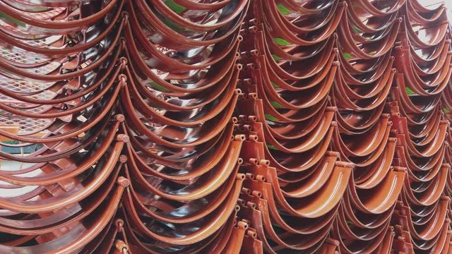 Red casing centralizers stacked on the deck of a drilling rig