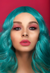 Fototapeta premium A beautiful girl with a bright pink makeup and a turquoise wig. Anime image.