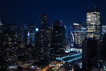 Obraz na płótnie Canvas Aerial and panorama view of skyscrapers of New York City, Manhattan. Top view of night midtown of Manhattan