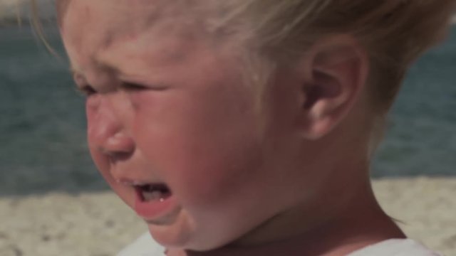 Little girl with tears in her eyes. Frustrated child. Crybaby.