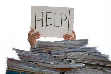 Person under a pile of papers with a hand holding a sign of help. Accounting. 