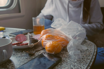 Products on the table in the second-class train carriage.