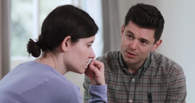 Depressed Woman Talking To Male Counselor