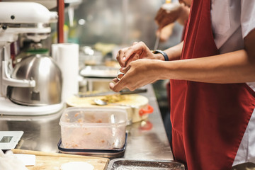 Cooks cooking in Chinese kitchen