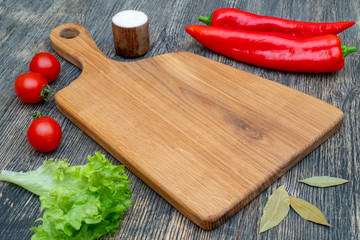 Oak cutting board on the kitchen table.