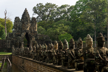 Beautiful stone sculptures lining the bridge that leads to the south gate of Angkor Thom
