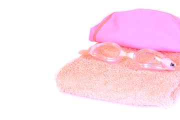 Watersports set pink color, swimming goggles, rubber cap and towel for girl isolated on white background. Copy Space