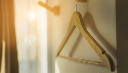 wooden hangers closet with selective focus on the hangers