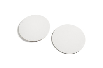 Two blank beer coasters isolated on white background. Clipping path.