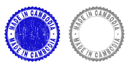 Grunge MADE IN CAMBODIA stamp seals isolated on a white background. Rosette seals with grunge texture in blue and gray colors. Vector rubber overlay of MADE IN CAMBODIA tag inside round rosette.