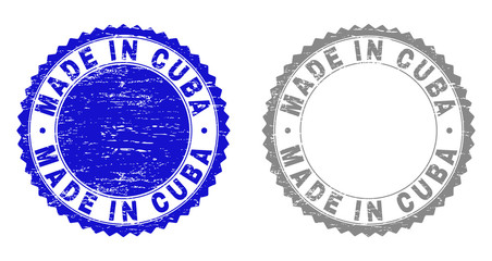 Grunge MADE IN CUBA stamp seals isolated on a white background. Rosette seals with distress texture in blue and gray colors. Vector rubber stamp imitation of MADE IN CUBA text inside round rosette.