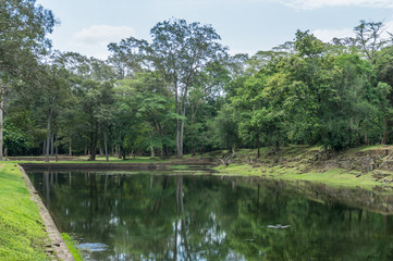 Fototapeta na wymiar Water reservoir inside the Angkor Wat temple complex