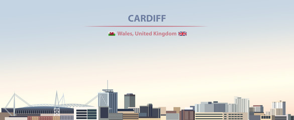 Naklejka premium Ilustracji wektorowych panoramę miasta Cardiff na tle kolorowe gradientu piękny dzień nieba z flagami Walii i Wielkiej Brytanii