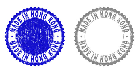 Grunge MADE IN HONG KONG watermarks isolated on a white background. Rosette seals with grunge texture in blue and grey colors.