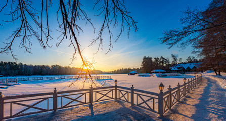 Winter sunrise over a snow-covered lake