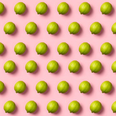 Limes pattern on pink background. Creative food concept. Flat la