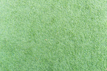 Texture of bright green artificial grass