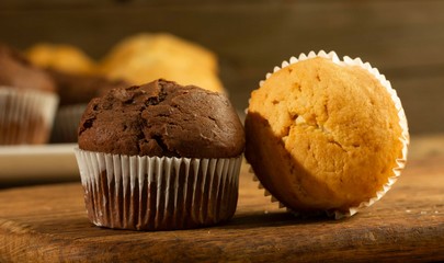 Chocolate cake and nut cake, homemade cakes on wooden background