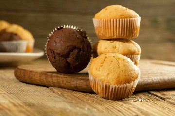 Chocolate cake and nut cake, homemade cakes on wooden background