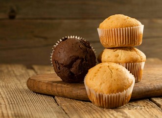Chocolate cake and nut cake, homemade cakes on wooden background