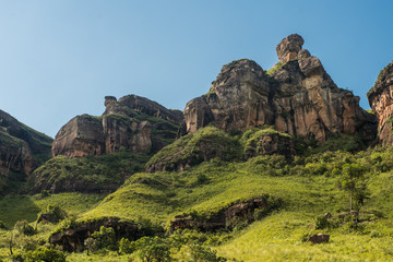 Eroded rock formations decorate a hill on the Tugela Gorge hike on the Amphitheatre mountain in the Drakensberg, South Africa