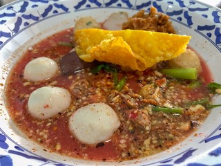 Fish balls with boiled pork blood in hot and spicy red soup (Yen ta four Tom yum in Thai word)