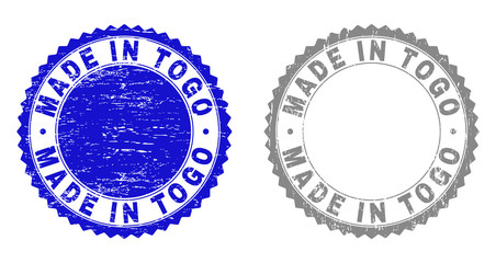 Grunge MADE IN TOGO stamp seals isolated on a white background. Rosette seals with grunge texture in blue and gray colors. Vector rubber stamp imprint of MADE IN TOGO tag inside round rosette.