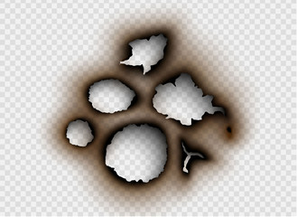 Hole torn in ripped paper with burnt and flame on transparent