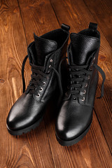 Ladies fashion leather shoes for autumn, spring, European winter. Boots for a modern grunge woman. Women's black boots with laces isolated on white. Black Leather Army Boots. Autumn. Fashion. Style.