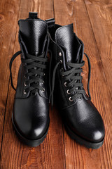Ladies fashion leather shoes for autumn, spring, European winter. Boots for a modern grunge woman. Women's black boots with laces isolated on white. Black Leather Army Boots. Autumn. Fashion. Style.