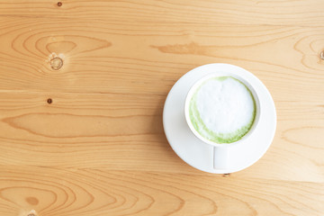 hot Matcha green tea latte beverage in table