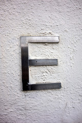 Written Wording in Distressed State Typography Found Letter E