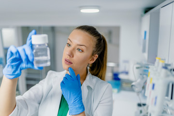 Portrait of a female researcher carrying out research in a chemistry lab