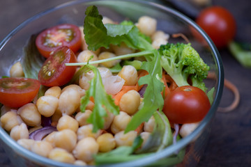 Healthy homemade chickpea and veggies salad, diet, vegetarian, vegan food  put on wooden background