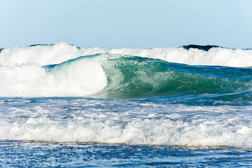 Ocean waves and blue sky background