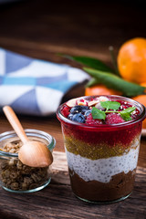 Healthy brunch with fruits and granola, served in jar