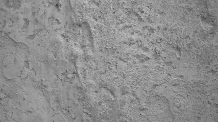 Gray background of the old wall. Natural texture with gray stone. Abstract cracked surface pattern
