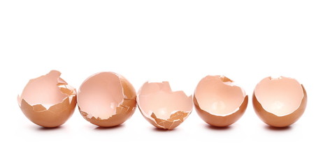 Cracked hen egg shells isolated on white background