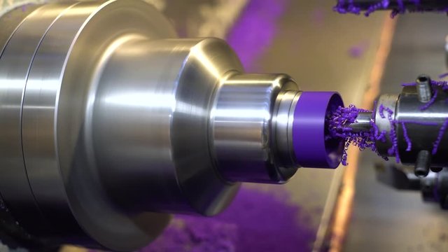 CNC lathe machining thermoplastic in a machine shop