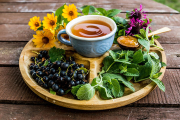 cup tea herb echinacea mint chamomile berry plant blueberry flavor aroma jam apricot sweetness dessert tea drinking traditional useful menu menus wooden ingredients