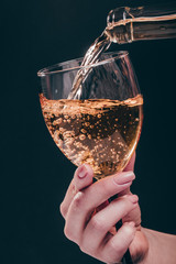 white wine pouring a glass