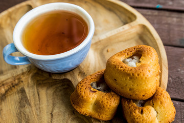 Cup of tea blue tree wooden cake biscuit dessert sweetness tea tea nature flavor flavor