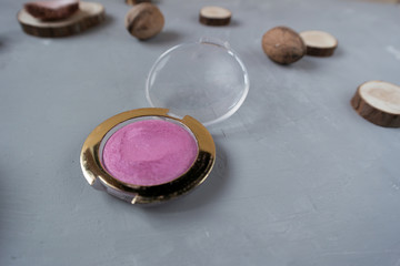  Pink eyeshadow on gray background
