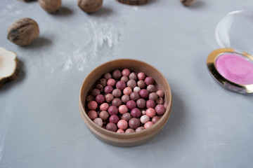  Pink blush on gray background