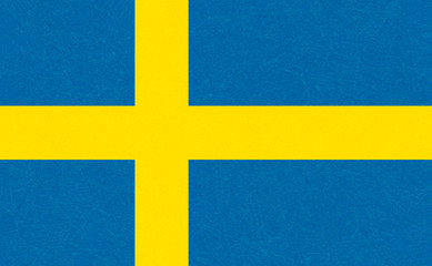 Obraz premium Sweden flag, Scandinavian country. Isolated Swedish banner with scratched texture, grunge. Flat style, vector with noise, marble textured background. Horizontal orientation.