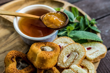 Mint grass herb tea jam jam apricot spoon wooden dessert tea drinking useful traditional cup blue