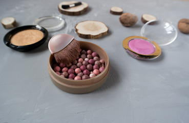 Pink blush on gray background