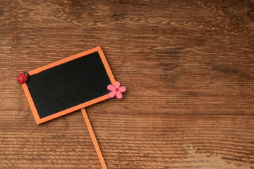 chalkboard on wooden background with copy space