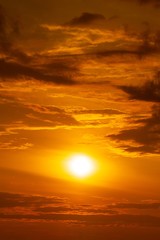Fototapeta premium The sun and the orange sky with clouds sunrise or sunset background