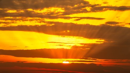 Nature background of golden sunrise sky and clouds